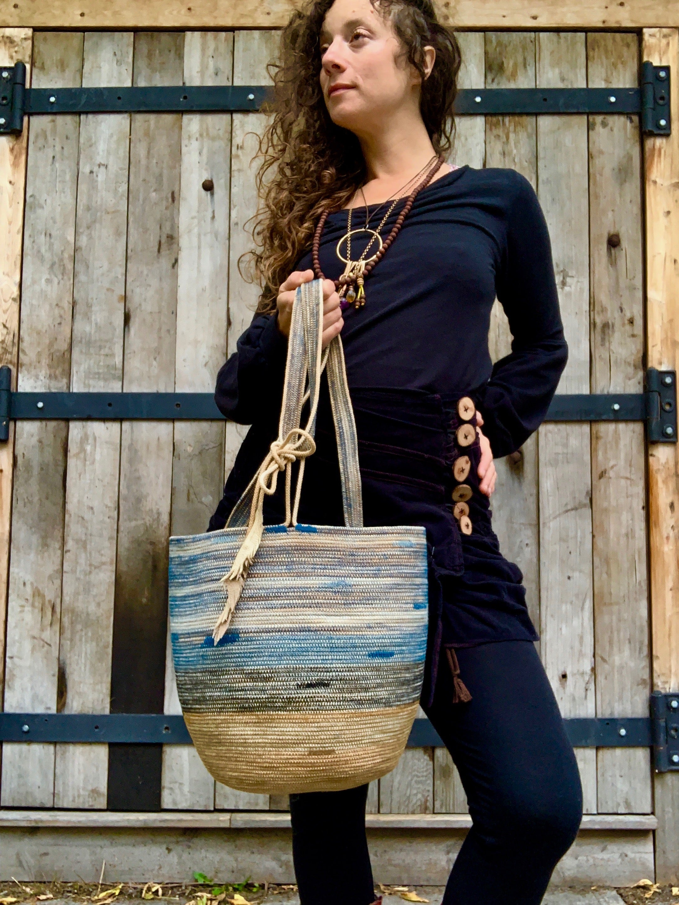 handmade rope basket with leather feather accent