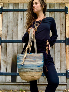 handmade rope basket with leather feather accent