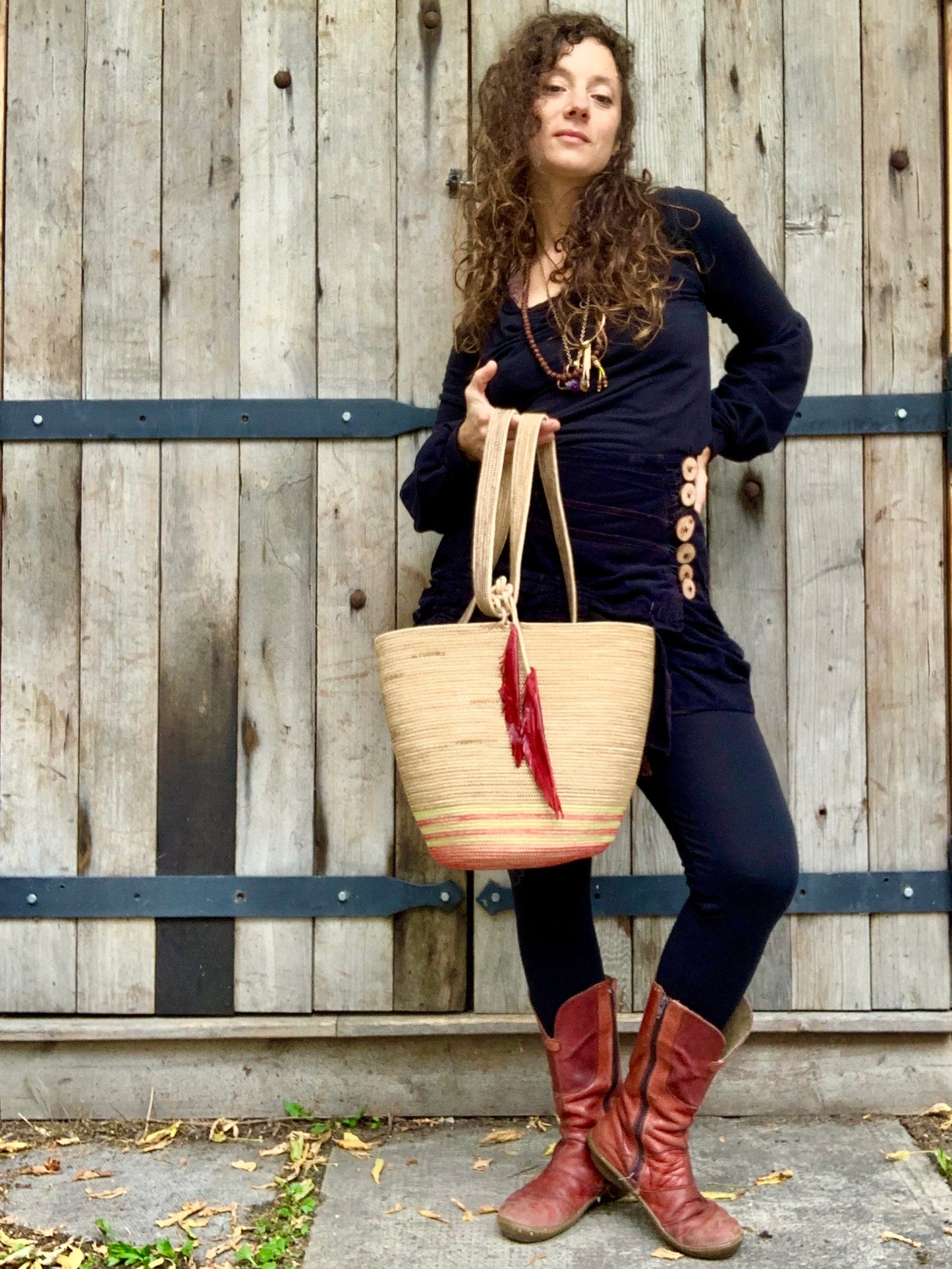 handmade rope backpack with feather accent